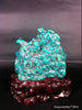 Natural blue turquoise stone with redwood stand 221.6 grams