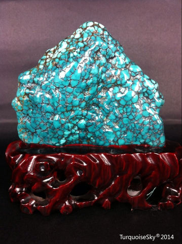 Natural blue turquoise stone with redwood stand 311.0 grams