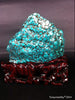 Natural blue turquoise stone with redwood stand 311.0 grams