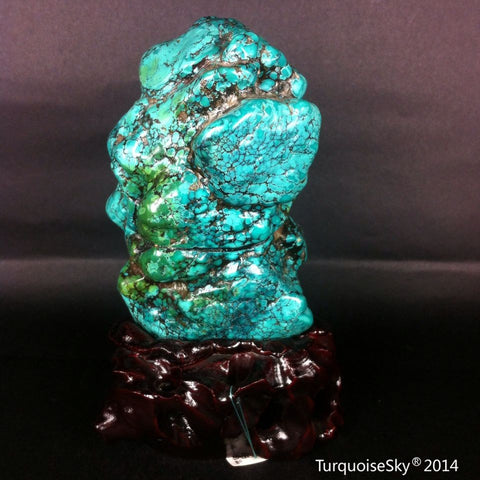 Natural blue turquoise stone with redwood stand 455.0 grams
