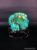 Natural blue turquoise stone with redwood stand 334.6 grams