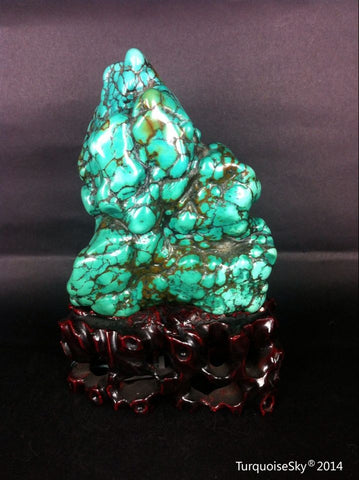 Natural blue turquoise stone with redwood stand 344.2grams