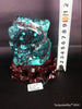 Natural blue turquoise stone with redwood stand 385.2 grams