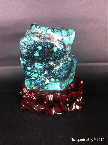Natural blue turquoise stone with redwood stand 385.2 grams