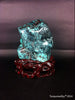 Natural blue turquoise stone with redwood stand 385.2 grams