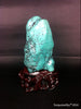 Natural blue turquoise stone with redwood stand 386.2 grams