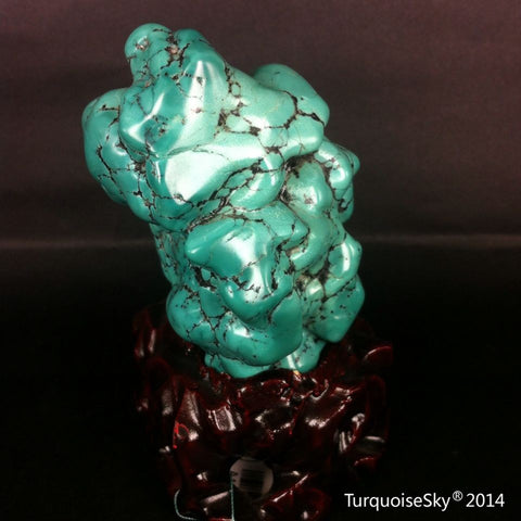 Natural blue turquoise stone with redwood stand 239.4 grams