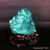 Natural blue turquoise stone with redwood stand 214.6 grams