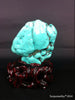 Natural blue turquoise stone with redwood stand 190.6 grams
