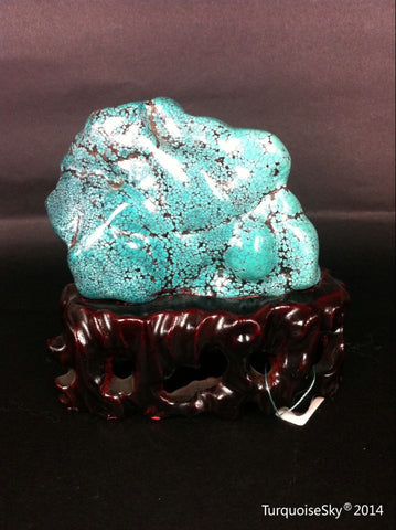 Natural blue turquoise stone with redwood stand 218.2 grams