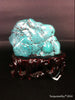 Natural blue turquoise stone with redwood stand 218.2 grams