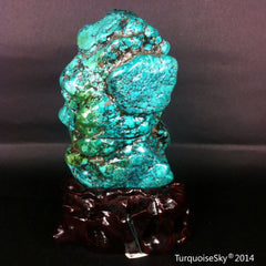 Natural blue turquoise stone with redwood stand 455.0 grams