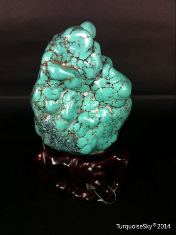 Natural blue turquoise stone with redwood stand 315.6 grams