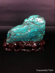 Natural blue turquoise stone with redwood stand 331.0 grams