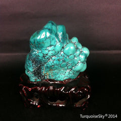 Natural blue turquoise stone with redwood stand 214.6 grams