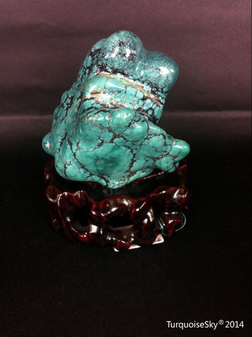 Natural blue turquoise stone with redwood stand 245.4 grams