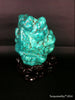 Natural blue turquoise stone with redwood stand 492.0 grams